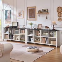 White open bookcase with multiple cubbies and a long top surface for decor
