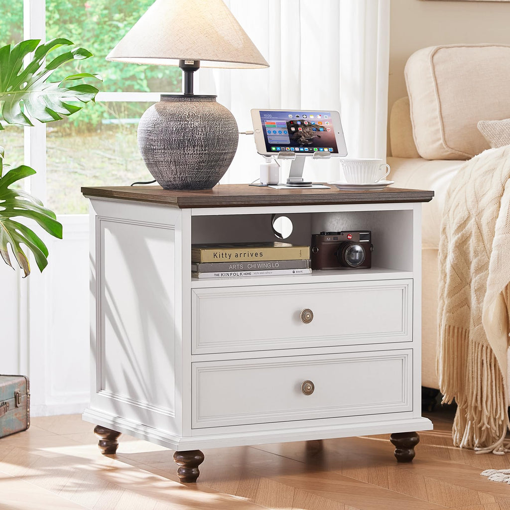 White dresser with two drawers, round knobs, and a lower open storage shelf