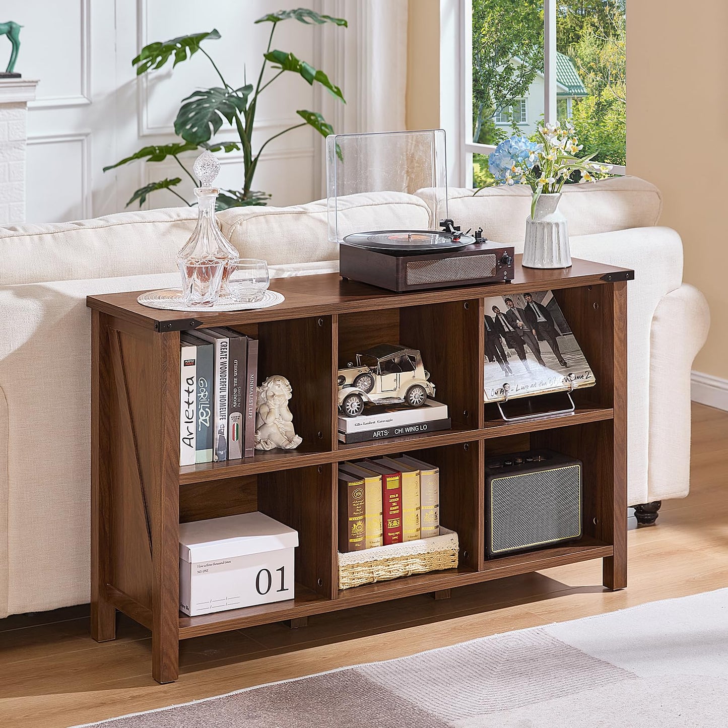 Brown wood bookcase with open cubby shelves and four legs for everyday storage