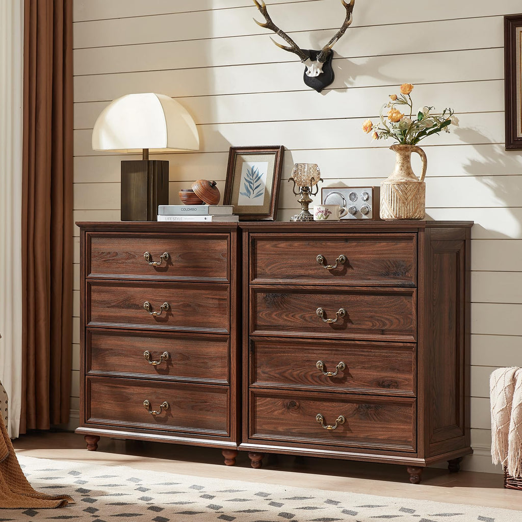 Dark wood double dresser with multiple drawers and ornate metal pulls