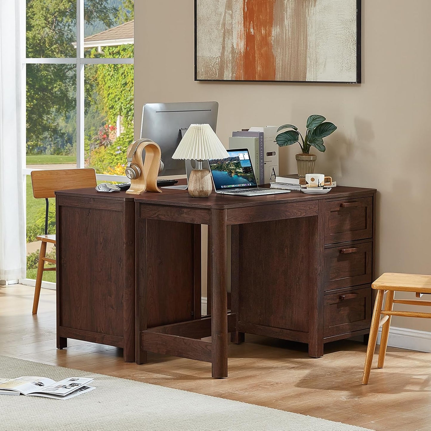 Dark walnut executive desk with cabinet doors and three drawers beneath