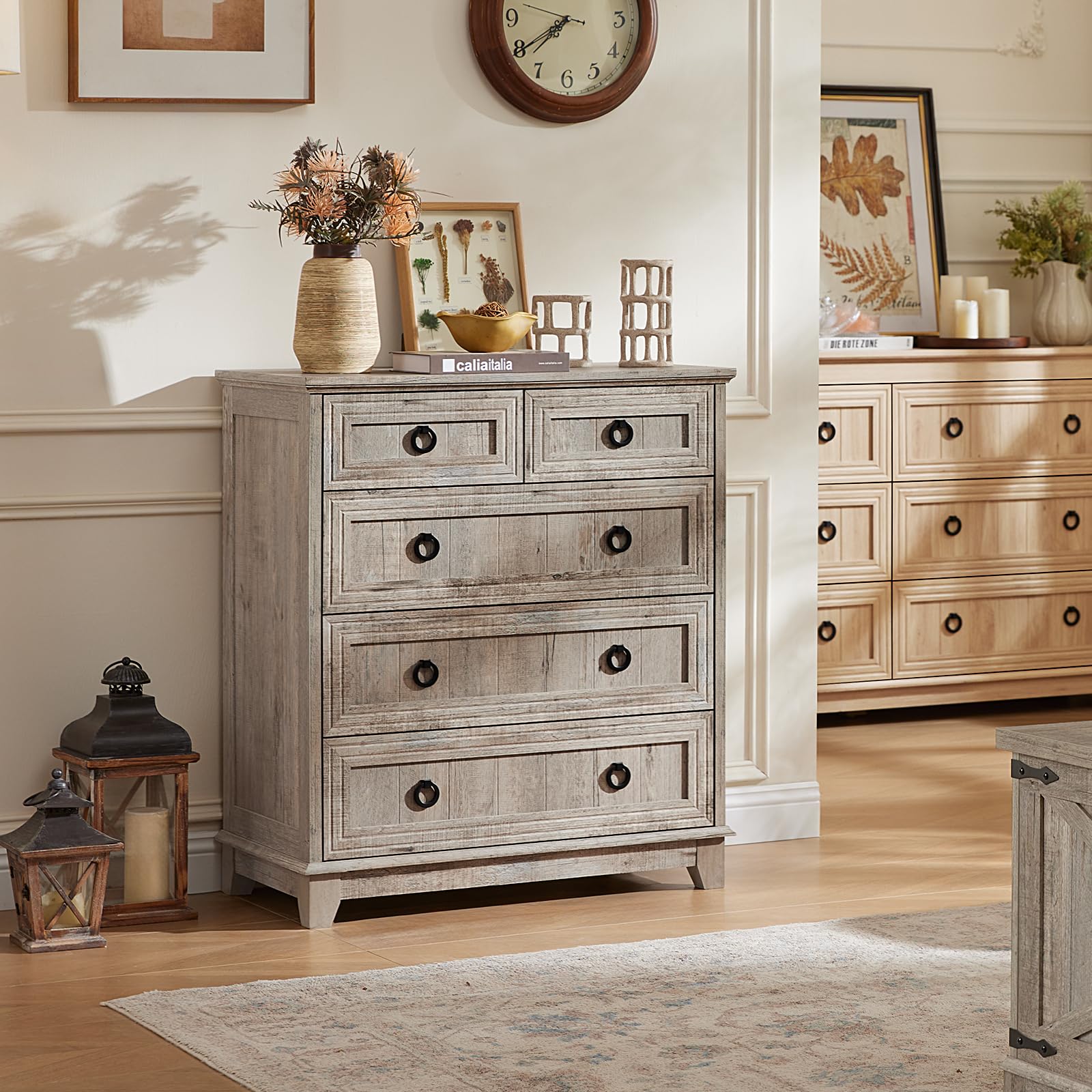 Gray farmhouse dresser with five drawers, round metal knobs, distressed wood surface