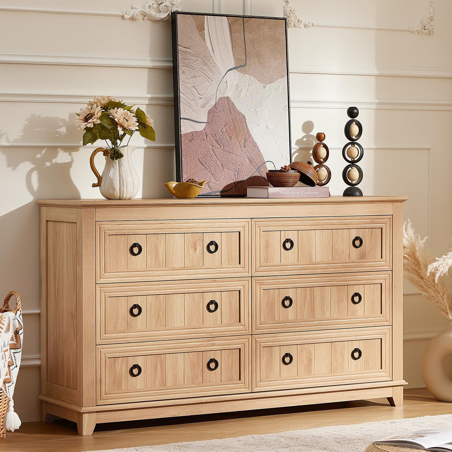 Light wood 6-drawer dresser with black knobs and rectangular paneled drawer fronts