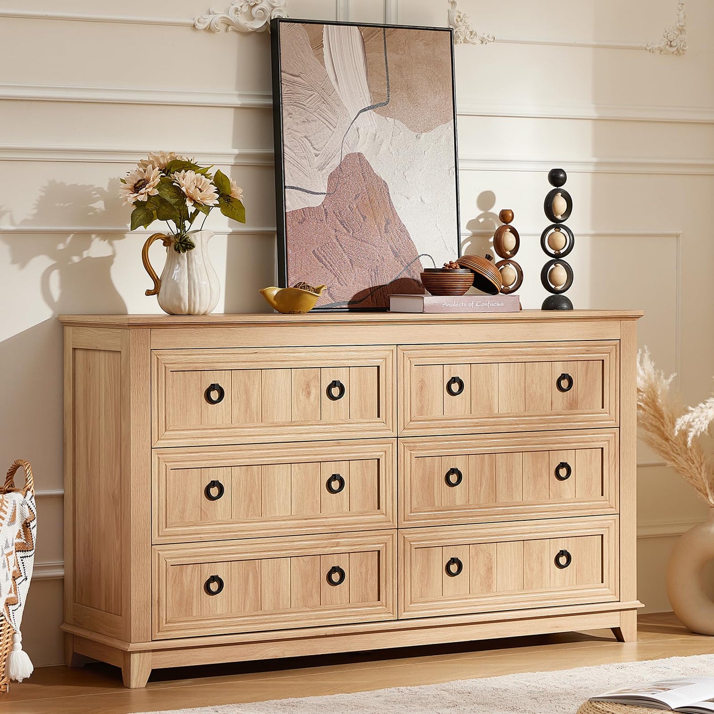 Light wood 6-drawer dresser with black knobs and rectangular paneled drawer fronts