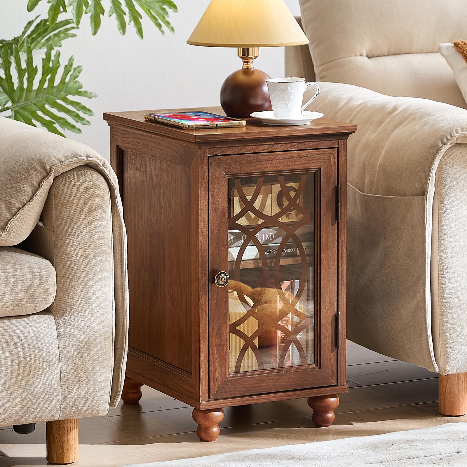 Brown bedside end table with glass cabinet door, brass knob, and top charging cords