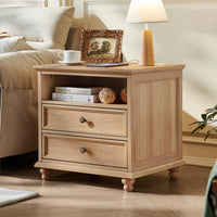Rustic wood bedside dresser with two drawers, metal knobs, and sturdy legs under a tabletop.
