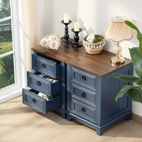 Navy nightstand with wood top and multiple drawers, round metal handles