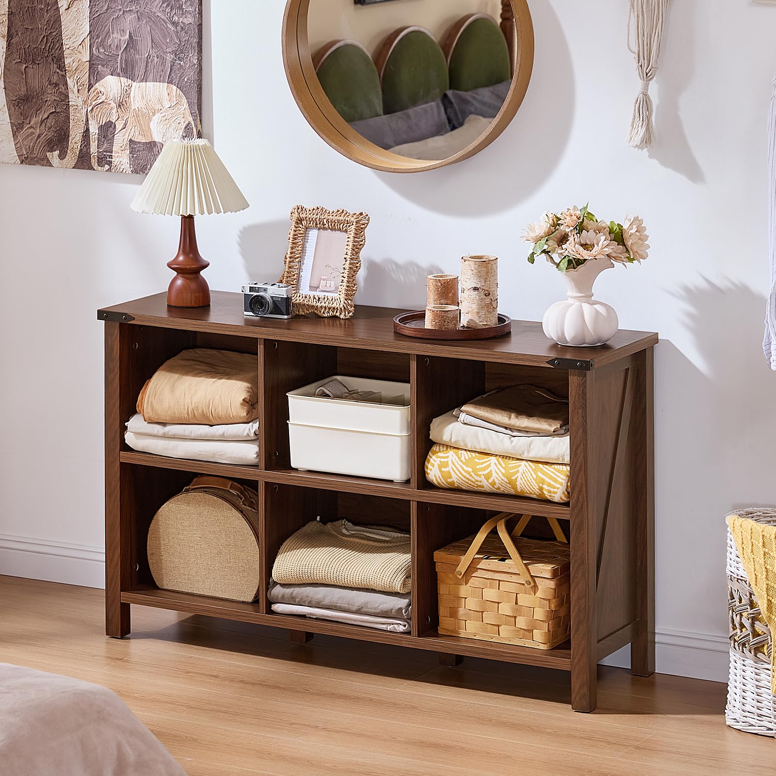 Brown farmhouse bookcase with open shelves, central storage drawer, and legs