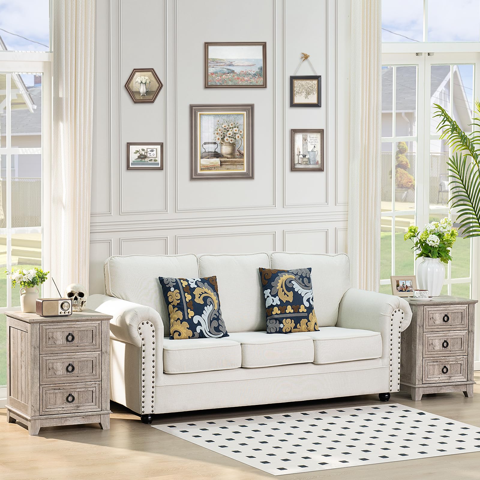 White farmhouse nightstand with three drawers and round metal handles