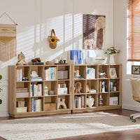 Natural oak cube storage book shelf with open cubbies and decorative items on top
