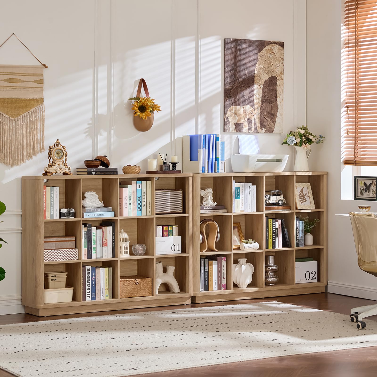 Natural oak cube storage book shelf with open cubbies and decorative items on top