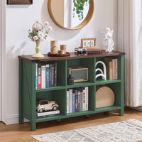 Green farmhouse bookcase with open cubbies and lower storage shelves, supported by legs