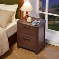 Walnut nightstand with two drawers and top charging station beside a lamp