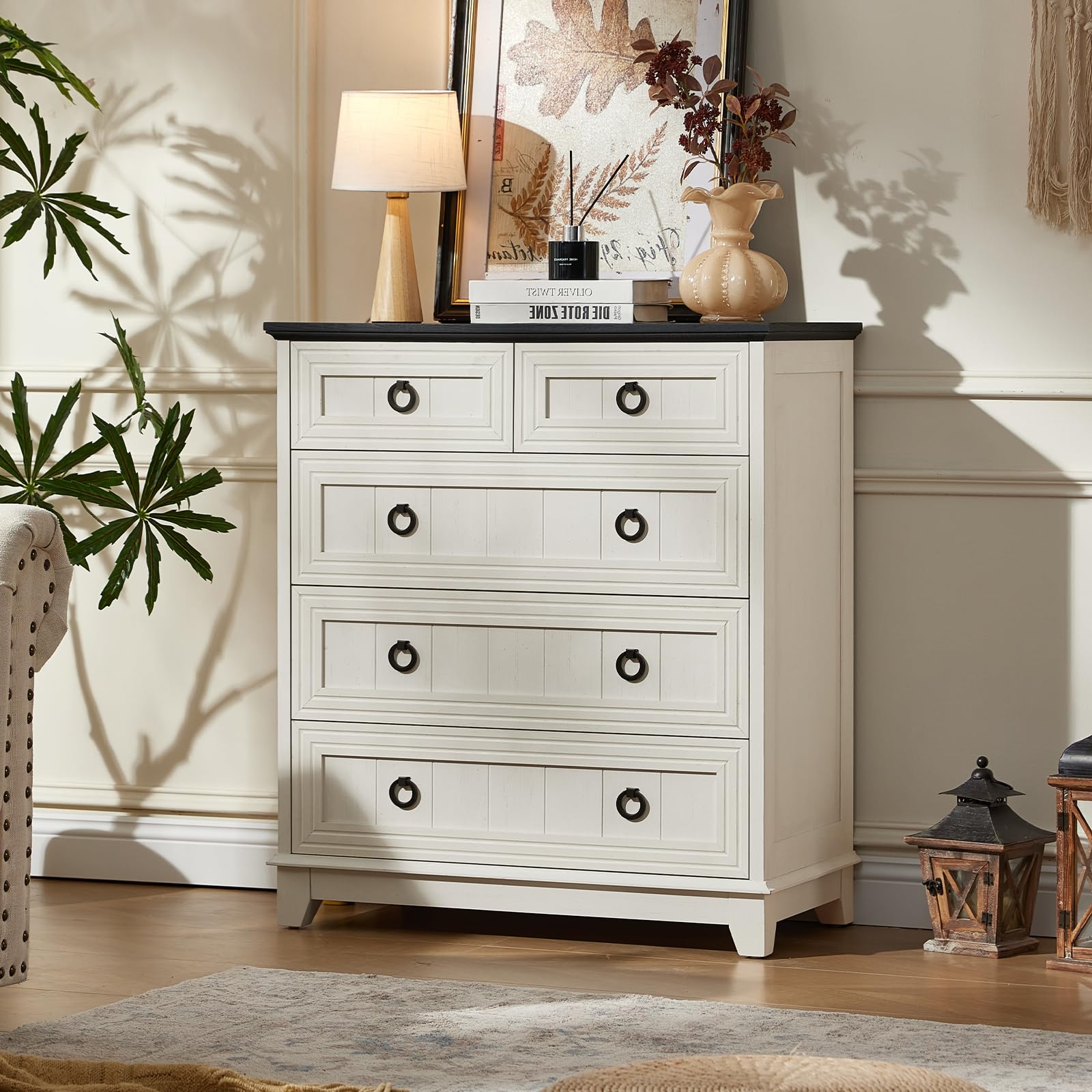 White farmhouse dresser with five drawers and round black metal handles