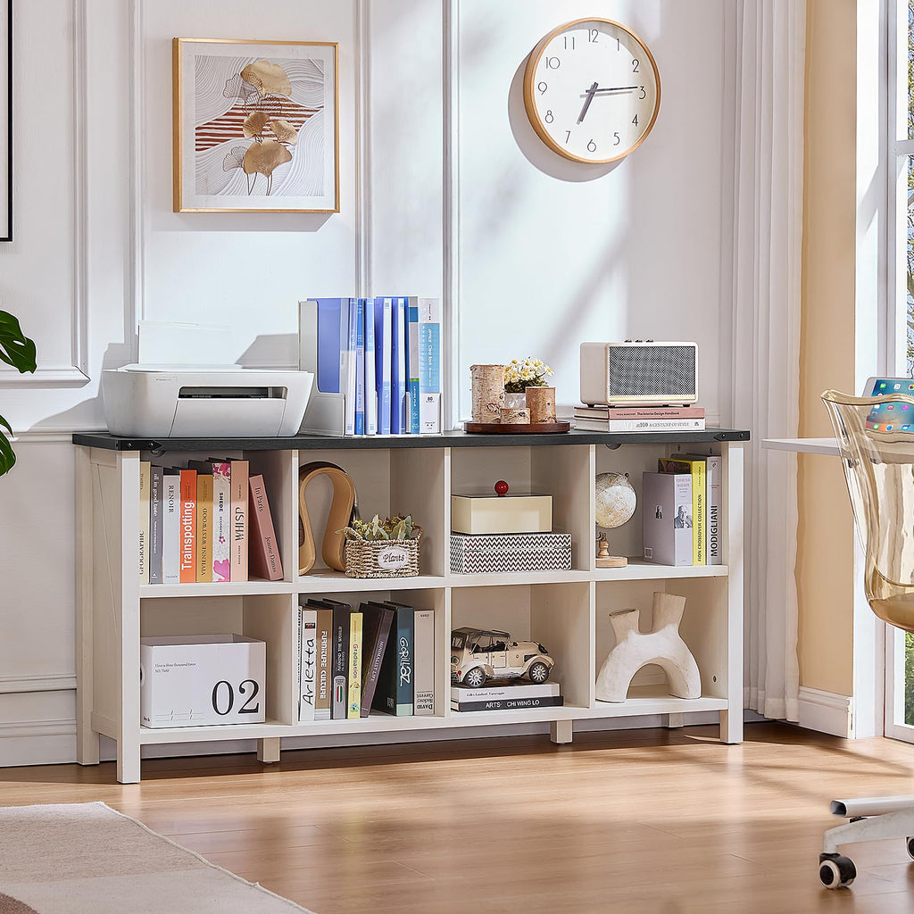 Dark blue open bookshelf console with storage cubbies and books on top
