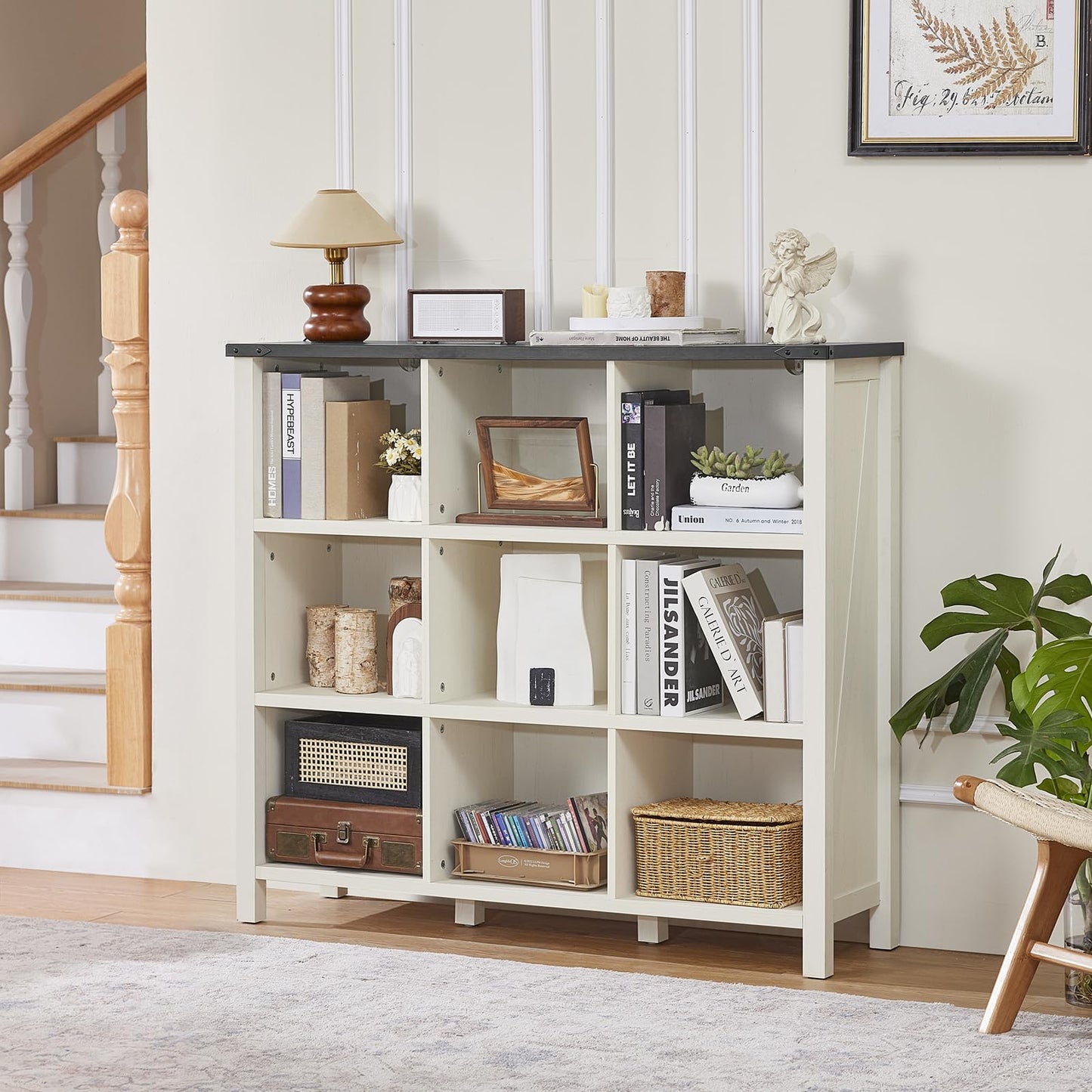 White console bookcase with open cubbies and tabletop for books, baskets, and plants