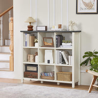 White console bookcase with open cubbies and tabletop for books, baskets, and plants