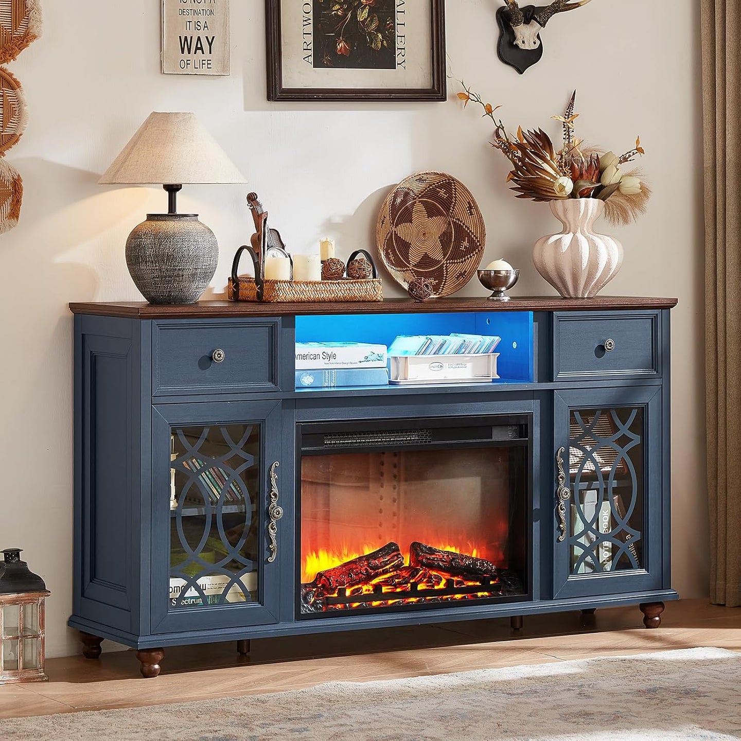 Blue farmhouse TV stand with electric fireplace and glass cabinet doors