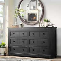Dark gray wood dresser with 6 drawers and black round knob pulls