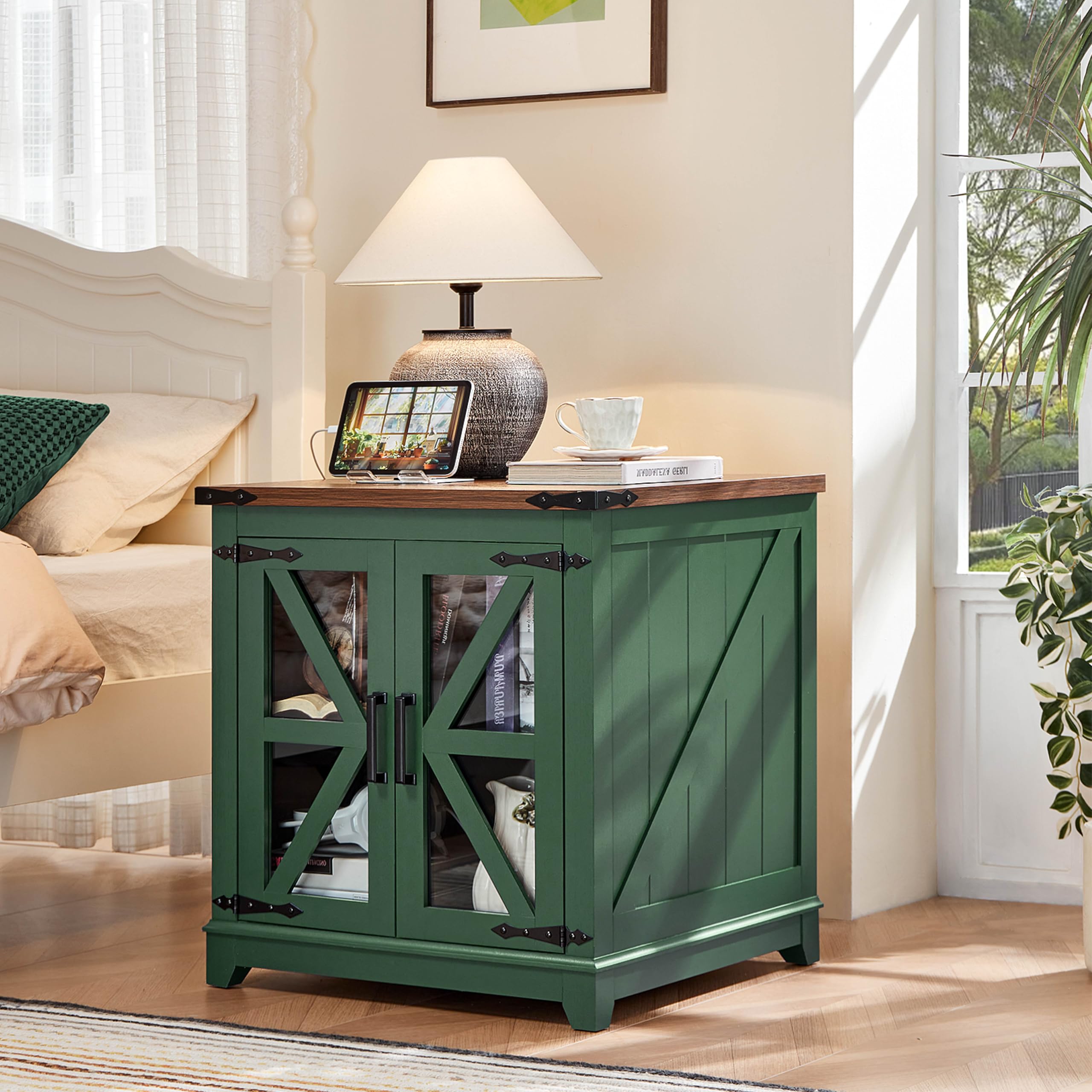 Green farmhouse end table with glass doors, X-style braces, and wooden tabletop