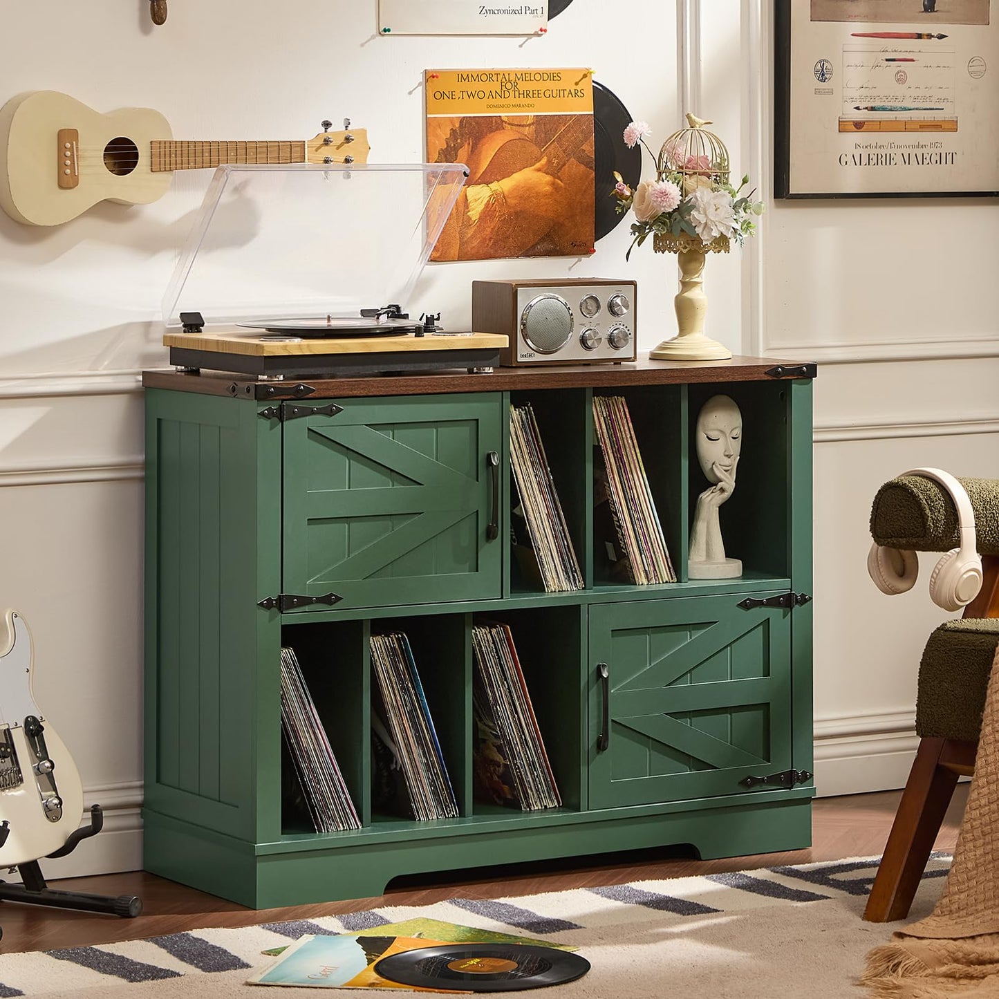 Record player cabinet with open record shelves and barn-style doors, green finish