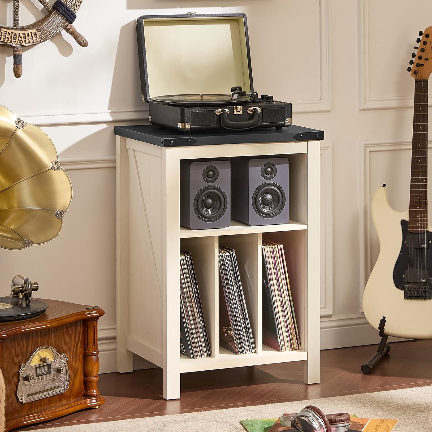 White record player stand cabinet with turntable on top and vinyl records in open shelf
