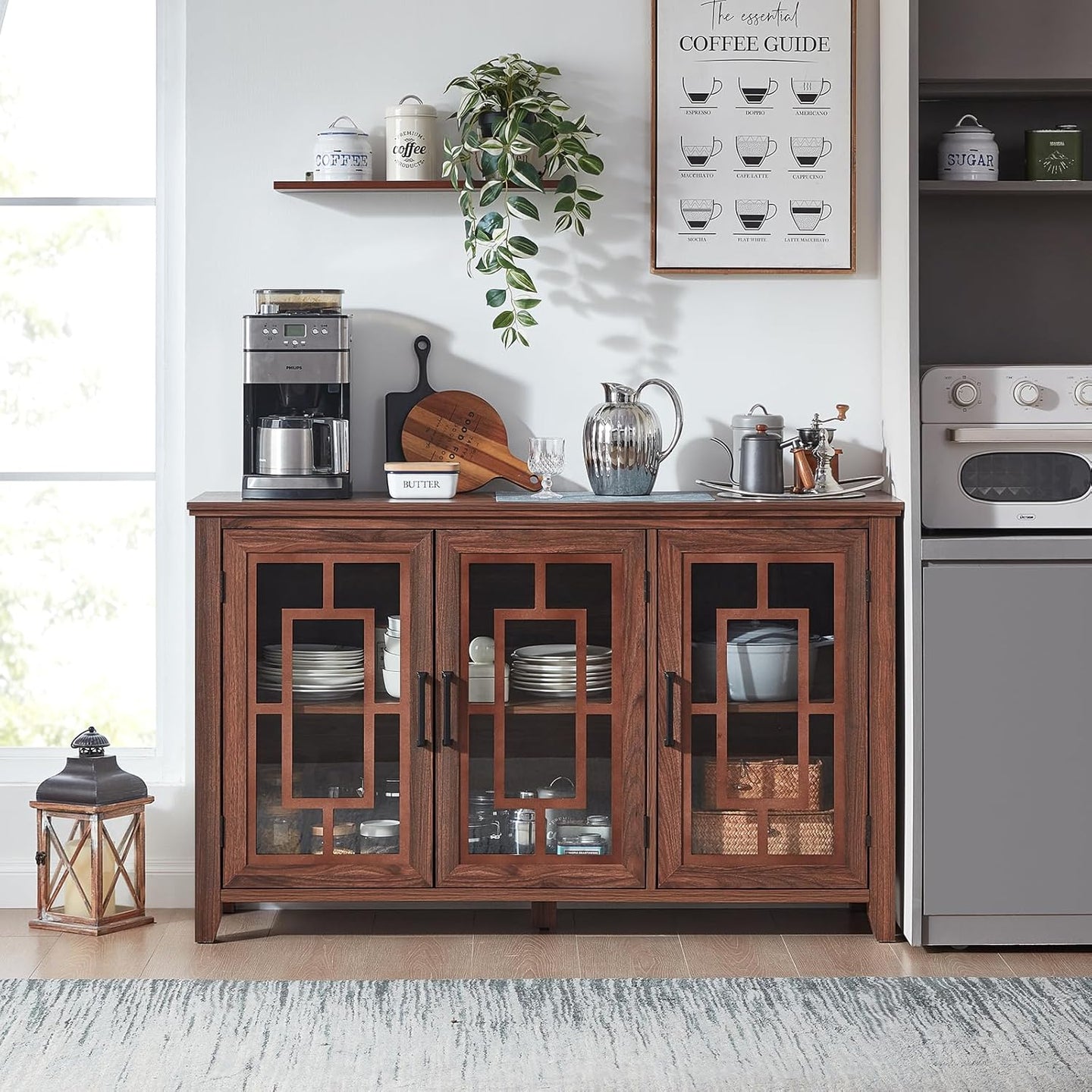 Brown sideboard buffet cabinet with three glass-front door panels