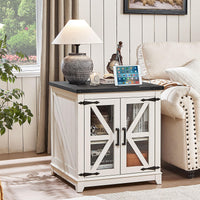 White farmhouse end table with black top and open storage shelves behind glass doors