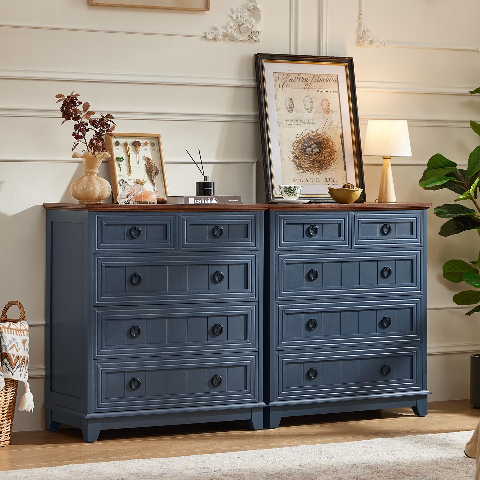Blue farmhouse dresser with multiple drawers and round metal drawer pulls